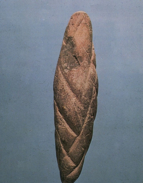 Token in the shape of a cylinder that may represent a rope dating to approximately 5500 B.P.
